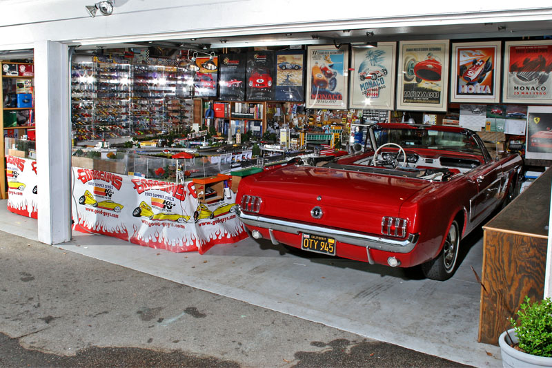 The garage with little toys and big toys.